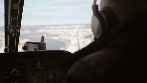 Pilot in helicopter Stock Footage 77203842