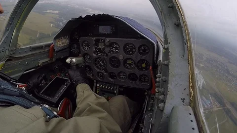Pilot hold helm. Gray jet aircraft is heading for the target. View of cockpit. Video stock 118677680