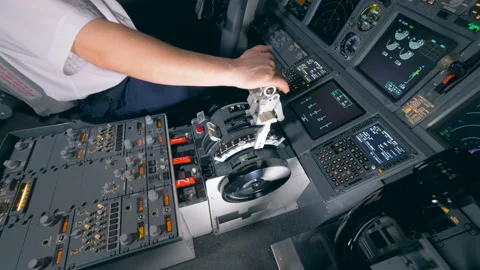 Pilot holds his hand on a lever in a cockpit, close up. 4K. Stock Footage 88609650