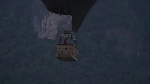 Pilot of hot air baloon is operating the lifting mechanism Stock Footage 329552203