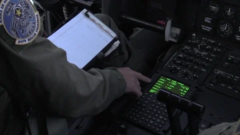 Pilot inputting data into C-130 Hercules computer Vídeos de archivo 99226876