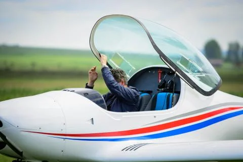 Pilot leaving the cockpit Stock Photos