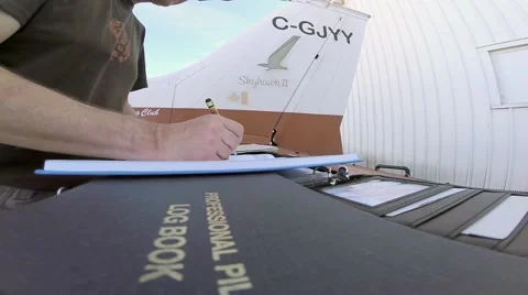 Pilot logging a flight. Stock Footage 40998057