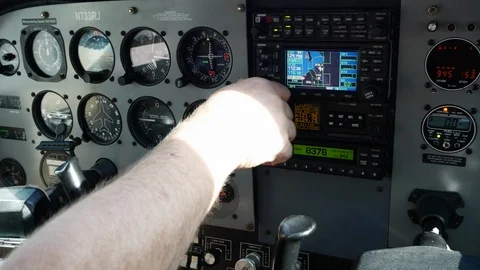 A pilot makes pre-flight checks on instrument panel in a Cessna 172. Video stock 98009266
