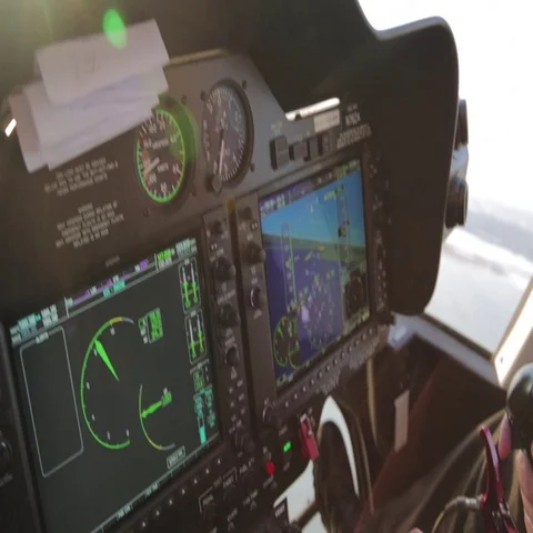 Pilot operating control panel in cockpit of helicopter Stock Footage