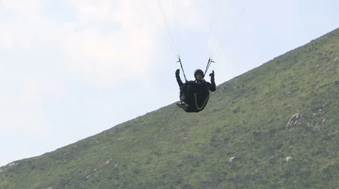 The pilot of a paraglider Stock Footage 60654885