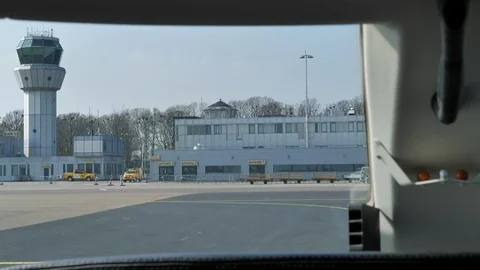 Pilot Point of View in Cockpit Vacating Runway towards ATC Tower Stock Footage 128647556