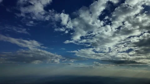 Pilot POV flying in deep blue sky late in the afternoon with some tiny Stock Footage 277177321