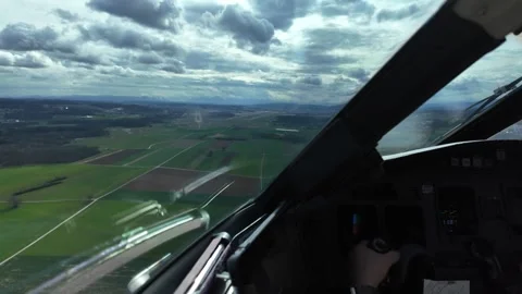 Pilot POV Flying Manually a Jet Airplane in the Final Approach to the Runway Stock Footage 334149799