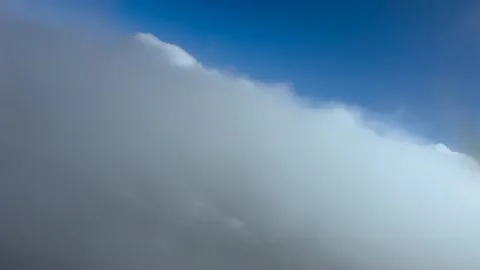 Pilot POV Flying Through Ethereal Layered Stratus Clouds in a Blue Sky Stock Footage 346593590