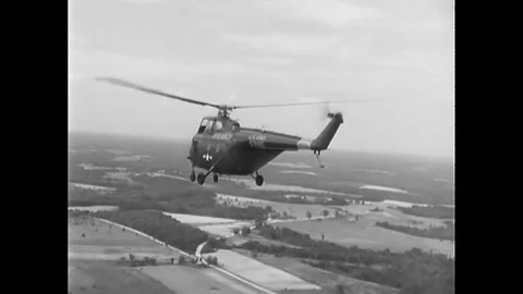 A pilot practices auto-rotation in the h-19 helicopter at the Fort Rucker Stock Footage 143853049