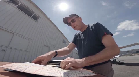 Pilot preparing a  flight plan. Stock Footage 40999612