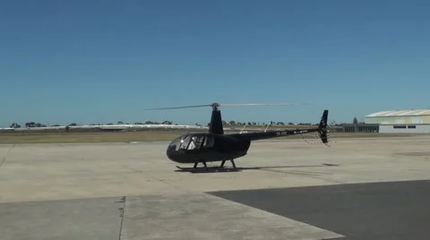 Pilot preparing to fly Robinson R44 Raven Stock Footage 51480137