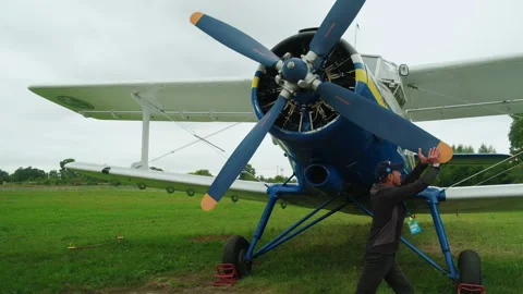 Pilot Preparing Plane for Departure. Starts Engine. Propeller at Aircraft Stock Footage 196202855