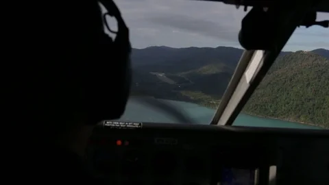 Pilot preparing small plane for landing over Whitsundays Stock Footage 71355191