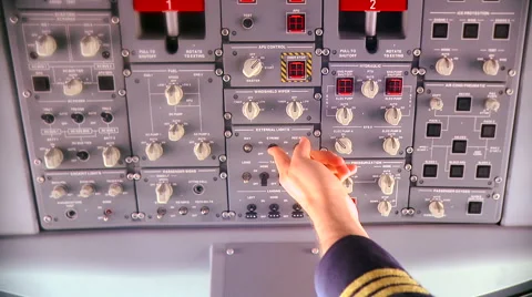 Pilot pressing button on the control panel of plane before takeoff Stock Footage 51571454