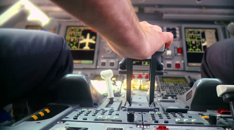 Pilot push thrust lever handle for takeoff a plane in the cockpit slowmotion Stock Footage 51571495