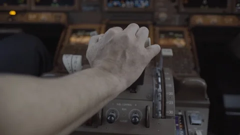 Pilot push thrust lever handle for takeoff a plane in the cockpit - ungraded Stock-Footage 115190887