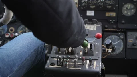 Pilot push thrust lever handle for takeoff a old plane in the cockpit. Stock-Footage 200786307