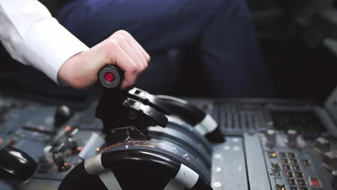The pilot pushes the lever to lift the plane in the cockpit. Stock Footage 132264448