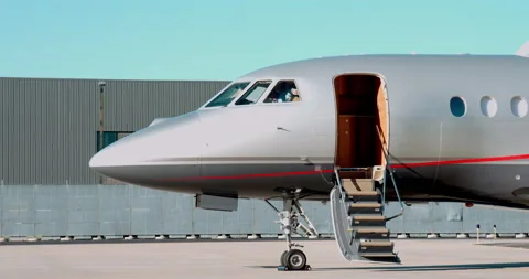 Pilot removing Sunshade from Lear Jet Stock Footage 168745834