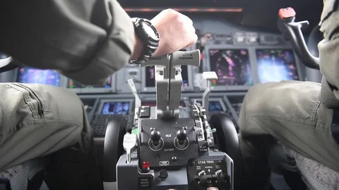 Pilot resting hand on throttle onboard Boeing P-8 Poseidon Stock Footage 110732323