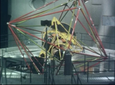 Pilot rotating during simulated flight in Multi-Axis Space Test Inertia Facility Stock Footage 262445130