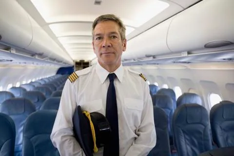 A pilot standing in the cabin of a plane Stock Photos