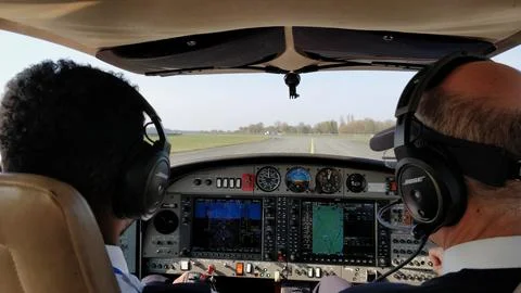 Pilot student and flight instructor taxiing DA42 twin star on taxiway A Stock Photos