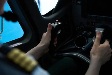 Pilot student operating aircraft controls during flight training Foto stock