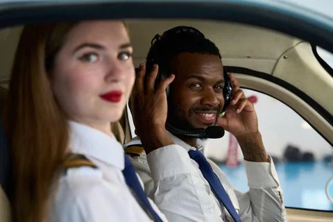 Pilot students training inside cockpit of airplane simulator Foto stock