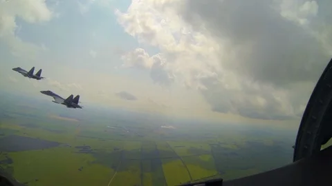 Pilot tries to evade jet by flying through clouds and shooting military aircraft Video stock 118553694