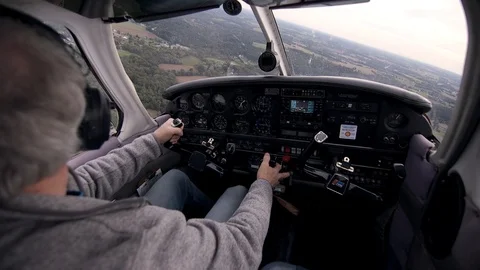 Pilot Turning Plane while Searching for Other Planes Stock Footage 99267999