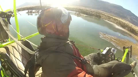 Pilot ultralight aircraft circle over frozen lake P HD 034-2 Stock Footage 10610577