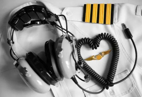 Pilot uniform and  headset. Stock Photos