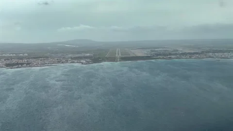 Pilot View in a Real Time Approach to Palma Airport with Heavy Wind and Raining Stock Footage 333679046