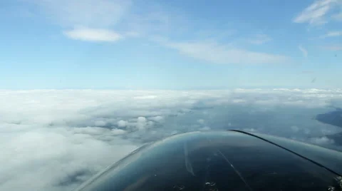 Pilot View of Small Airplane Flying Above Clouds Stock Footage 43146638