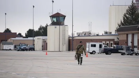 Pilot walking along air field Stock Footage 83677796
