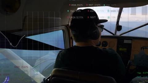 Pilot wearing headset sitting cockpit monitoring gauges while showing finance Stockbeeldmateriaal 309097802