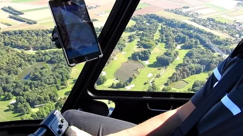 Piloting a Robinson R44 Helicopter over trees Видео 74017544