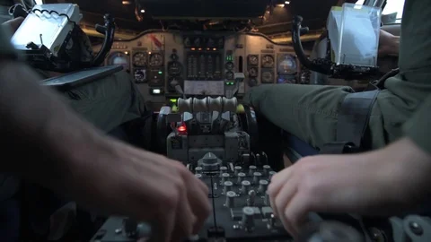 Pilots adjusting cockpit controls in E-3 Sentry Video stock 97818926