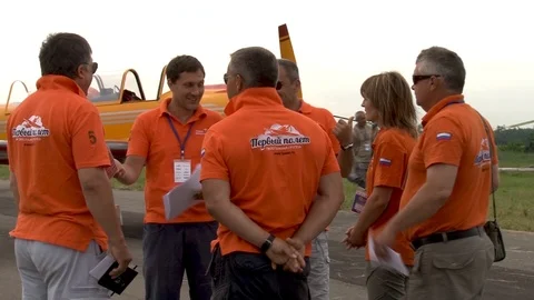 Pilots from aerobatic team First flight on preflight directions. Stock Footage 106232528