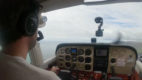 Pilots In Cockpit Flying Small Plane On A Cloudy Day - Close up shot Video stock 202023266