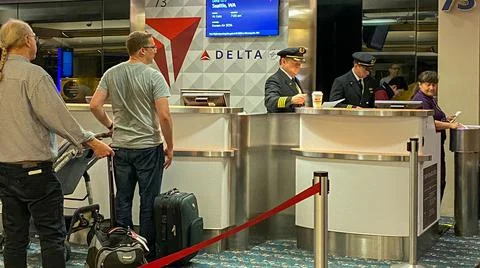 Pilots in a Delta gate preparing to fly out to their destination at the Orlan Stock Photos