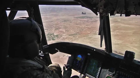 Pilots fly  CH-47F Chinook helicopters Stock Footage 33498153