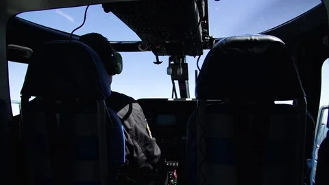 Pilots flying a helicopter Stock Footage 71568637