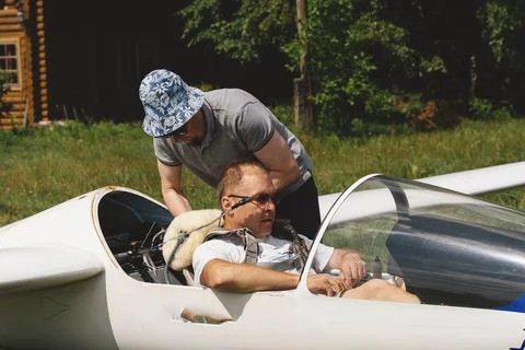Pilots getting ready for the flight on glider airplane Stock Photos