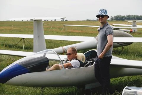 Pilots getting ready for the flight on glider airplane Stock Photos