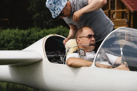 Pilots getting ready for the flight on glider airplane Stock Photos