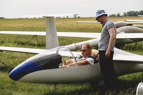 Pilots getting ready for the flight on glider airplane Stock Photos